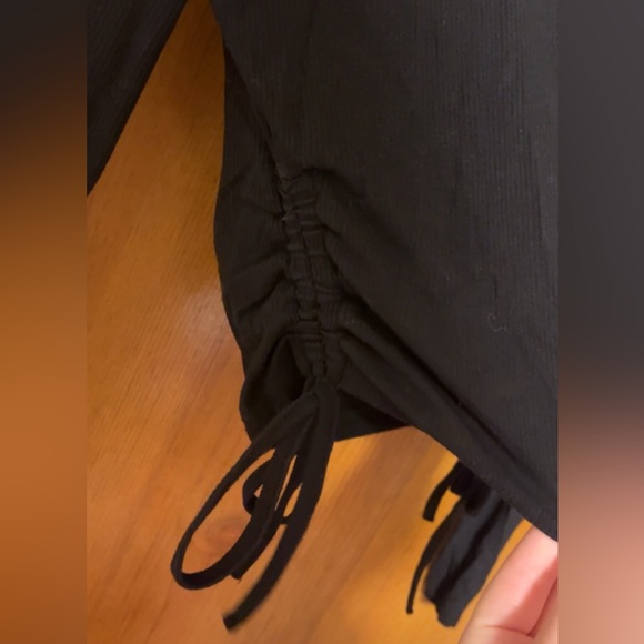 Long sleeve, tight fitted, black, side scrunch, partial crop top. - Picture 2 of 3